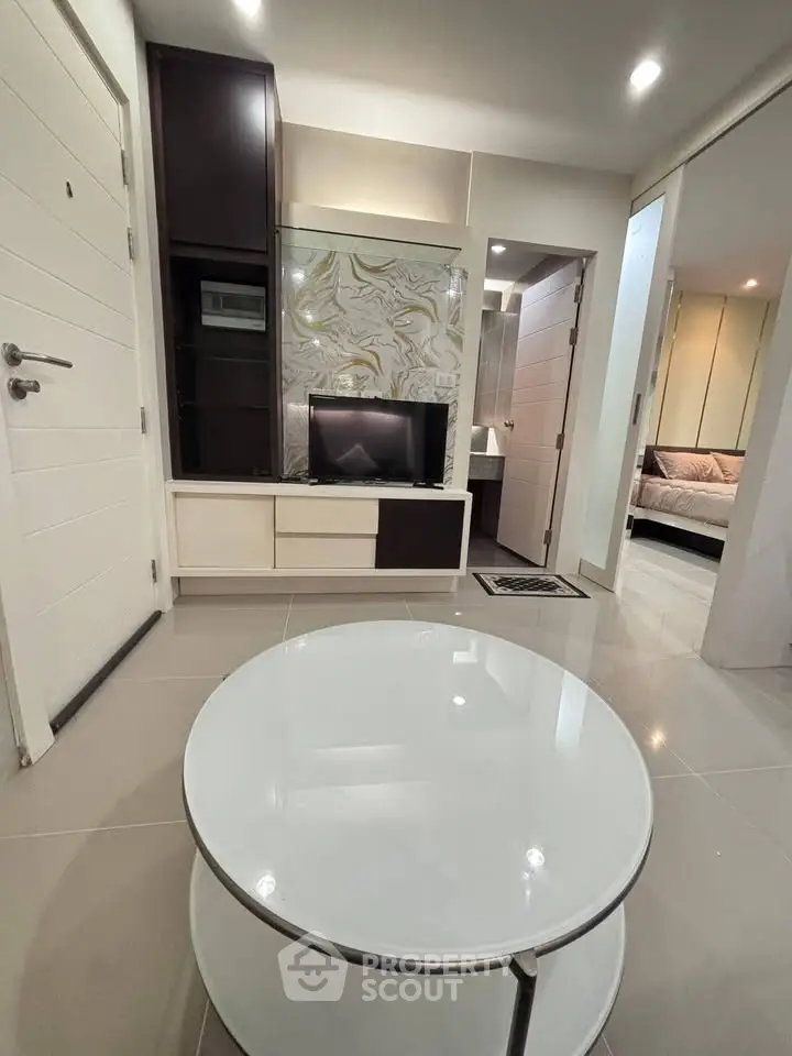 Modern living room with sleek furniture and stylish decor in a contemporary apartment.