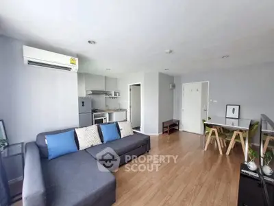 Modern living room with open kitchen and stylish decor