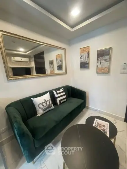 Chic modern living room with elegant green sofa and stylish decor