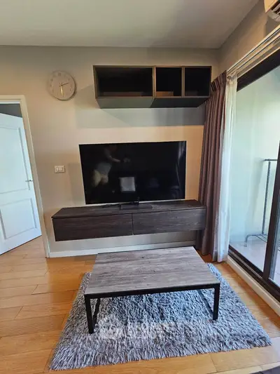 Modern living room with sleek TV setup and stylish furniture