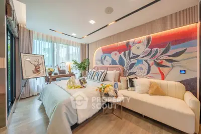 Luxurious bedroom with artistic wall design and cozy seating area, perfect for relaxation.