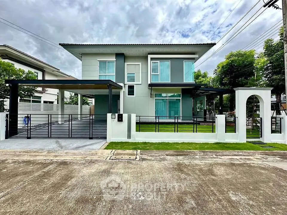 Modern two-story house with sleek design and spacious driveway