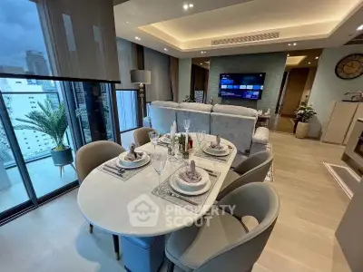 Luxurious modern living room with elegant dining area and city view balcony.
