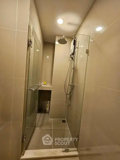 Modern bathroom with glass shower enclosure and sleek design