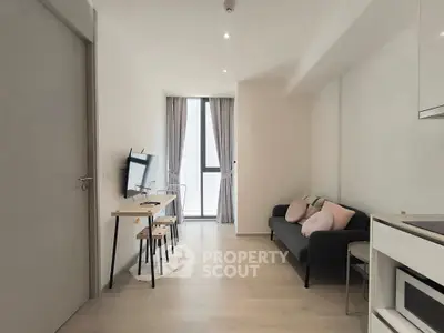 Modern living room with sleek furniture and natural light, perfect for urban living.