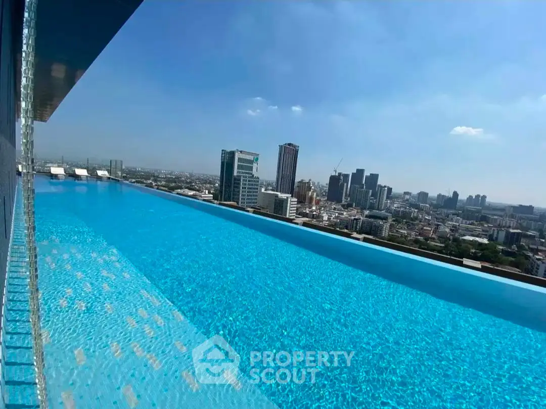 Stunning rooftop infinity pool with breathtaking city skyline view