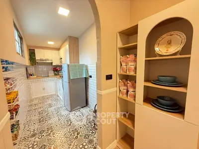 Charming kitchen with open layout and stylish patterned tiles