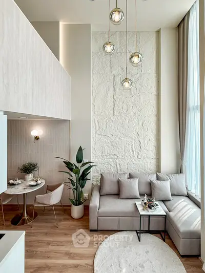 Modern living room with high ceiling and stylish decor