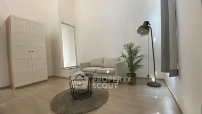 Modern minimalist living room with cozy sofa and stylish decor