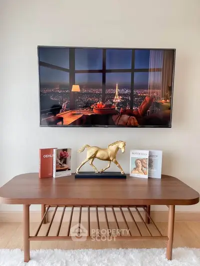 Stylish living room with modern decor and mounted TV displaying cityscape view.