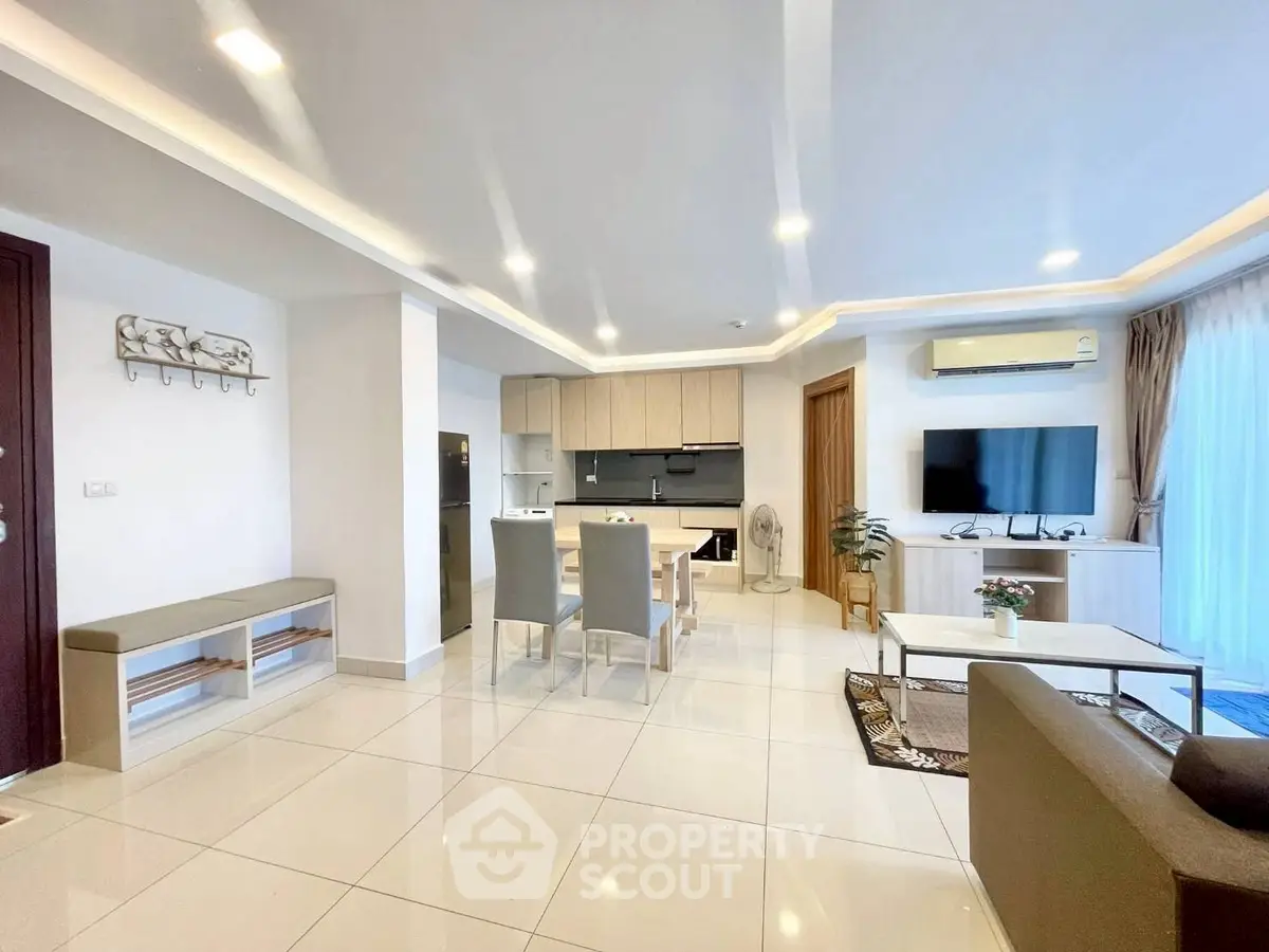 Spacious modern living room with open kitchen and elegant decor