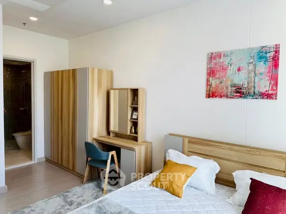 Modern bedroom with stylish decor and wooden furniture