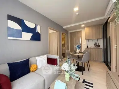 Modern living room with stylish decor and open kitchen layout