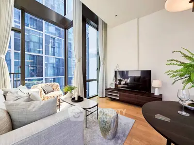 Modern living room with floor-to-ceiling windows and stylish decor in a high-rise apartment.