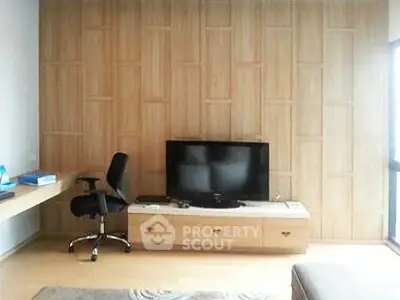 Modern living room with wooden panel wall and sleek furniture