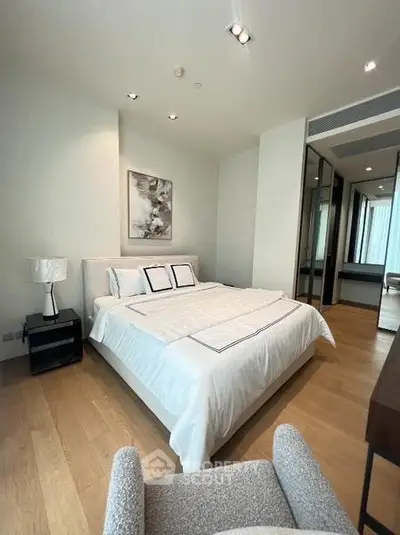 Modern bedroom with elegant decor and wooden flooring in luxury apartment