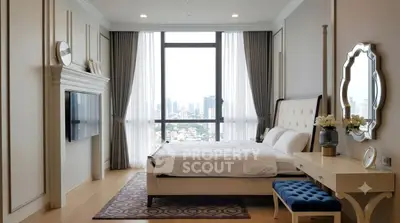 Luxurious bedroom with stunning city view, elegant decor, and ample natural light.