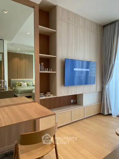 Modern living room with wall-mounted TV and elegant wooden furniture