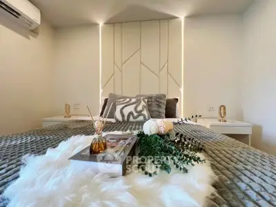 Luxurious bedroom with plush bedding and elegant decor, perfect for relaxation and comfort.