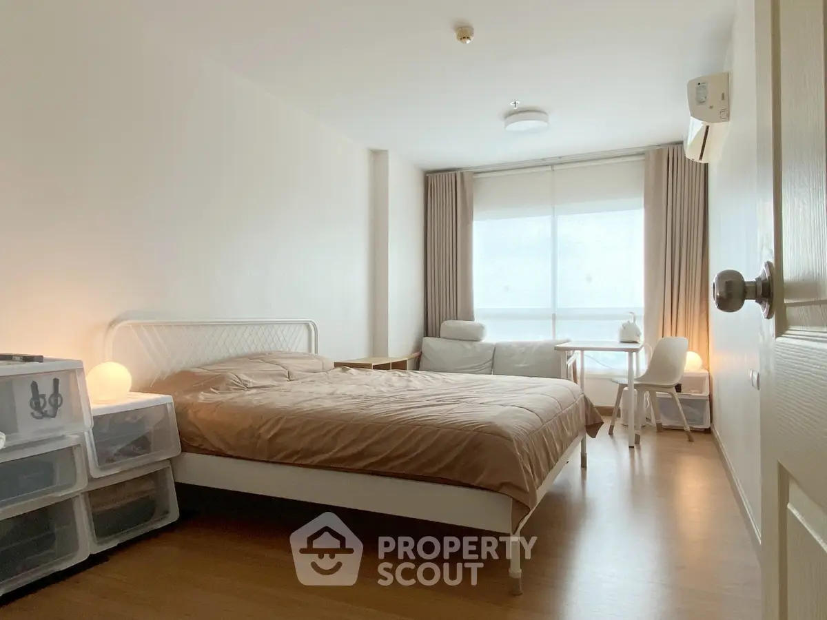 Cozy bedroom with modern furnishings and natural light