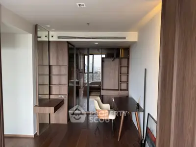 Modern study room with wooden furniture and city view from window