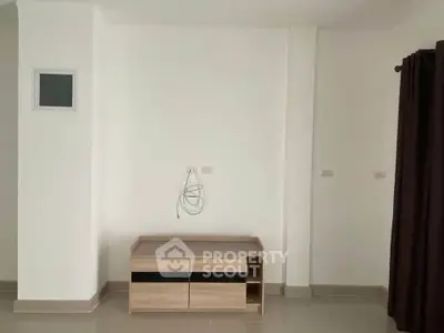 Minimalist interior with modern TV stand and neutral tones