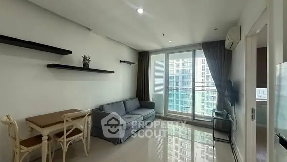 Modern living room with sleek design and city view balcony access.