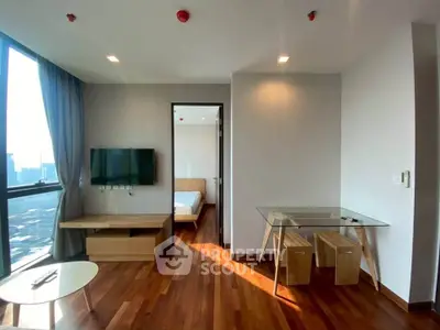 Modern apartment living room with wooden flooring and city view