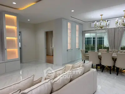 Luxurious living room with elegant dining area and modern lighting