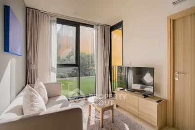 Bright and cozy living room with modern decor and balcony view