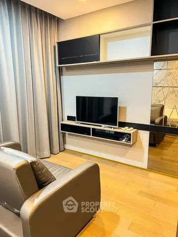 Modern living room with sleek TV setup and stylish shelving