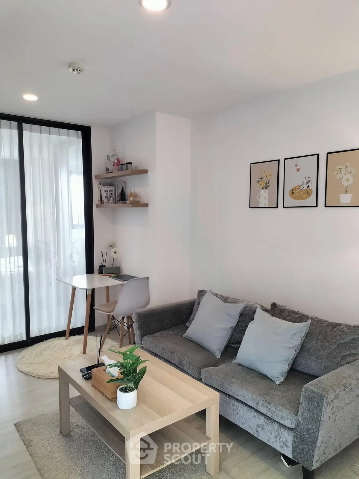 Modern living room with stylish decor and cozy seating area, perfect for relaxation and entertaining.