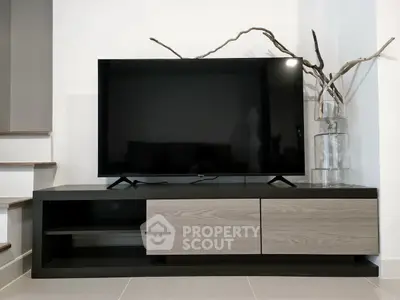 Modern living room with sleek TV stand and minimalist decor