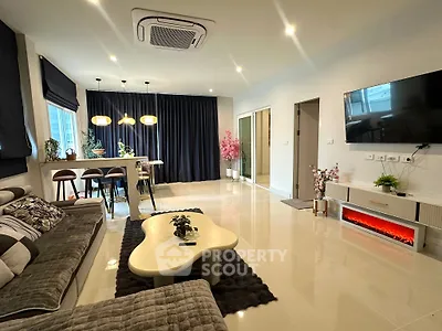 Spacious modern living room with stylish decor and open kitchen layout
