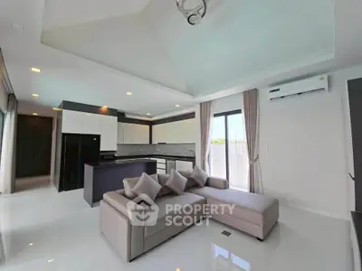 Spacious modern living room with open kitchen and elegant decor