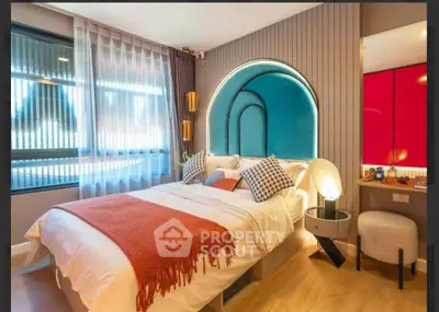 Stylish modern bedroom with unique arch design and vibrant decor