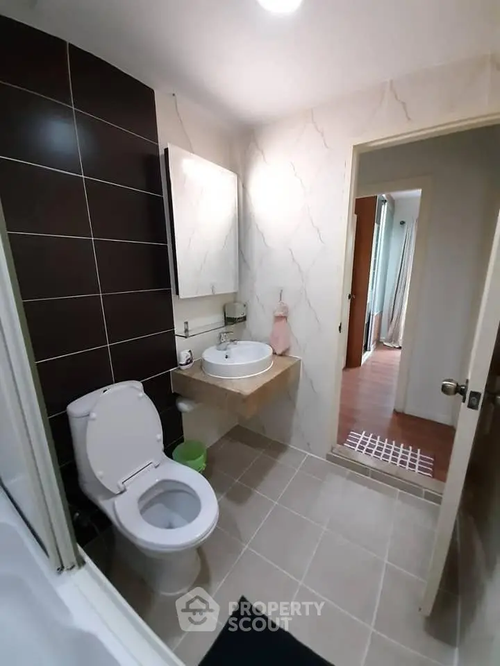 Modern bathroom with sleek design and elegant fixtures in a contemporary home.