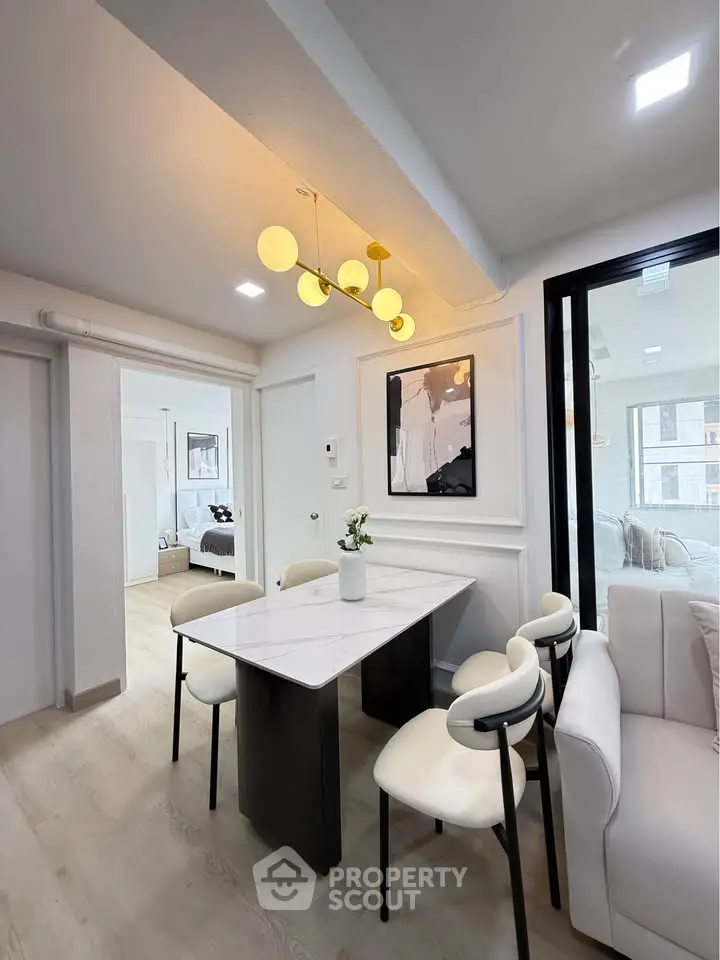 Modern dining area with elegant lighting and contemporary decor