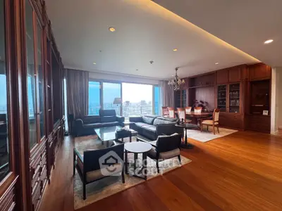 Luxurious living room with panoramic city view, elegant wooden flooring, and sophisticated furniture.