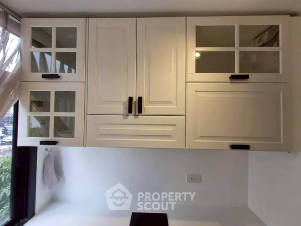 Elegant kitchen cabinets with glass doors and modern handles