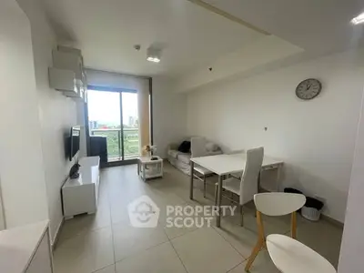 Modern living room with balcony view and minimalist decor