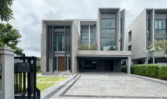 Modern luxury home with sleek architecture and spacious driveway