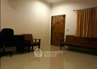 Spacious living room with elegant furniture and polished flooring