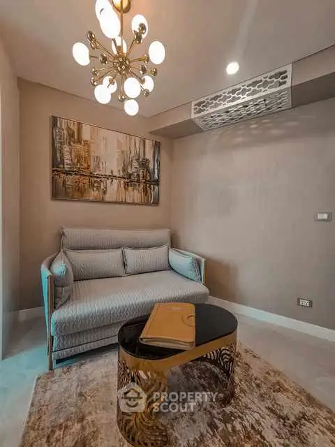 Elegant living room with stylish sofa and modern chandelier