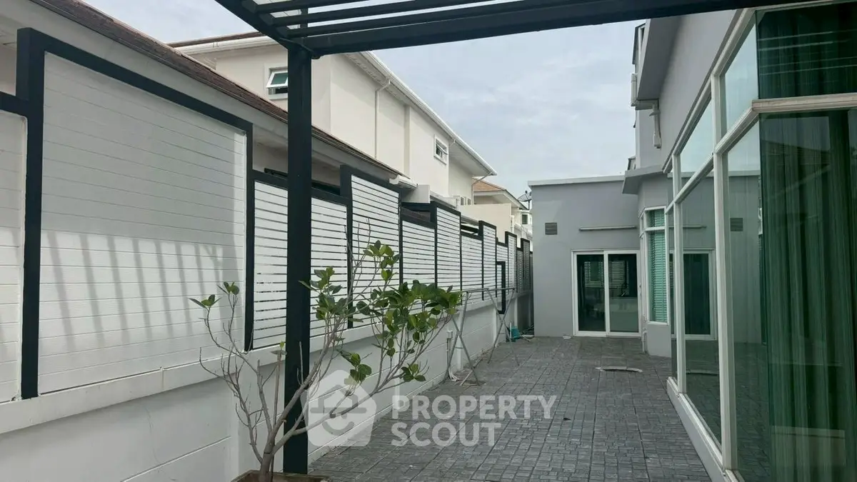 Modern exterior with sleek design and spacious patio area