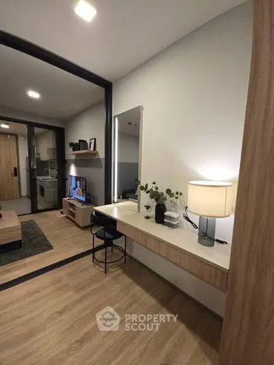 Modern apartment interior with stylish decor and open layout, featuring a cozy living area and elegant lighting.