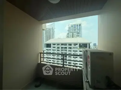 Urban balcony with city view and air conditioning unit