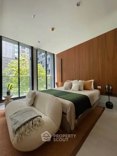 Luxurious modern bedroom with floor-to-ceiling windows and stylish decor