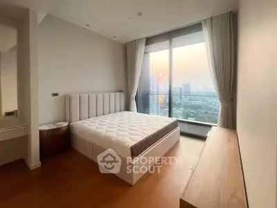 Spacious bedroom with stunning city view and modern furnishings