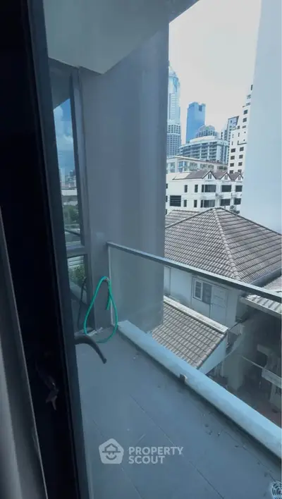 Modern balcony with city view in high-rise apartment